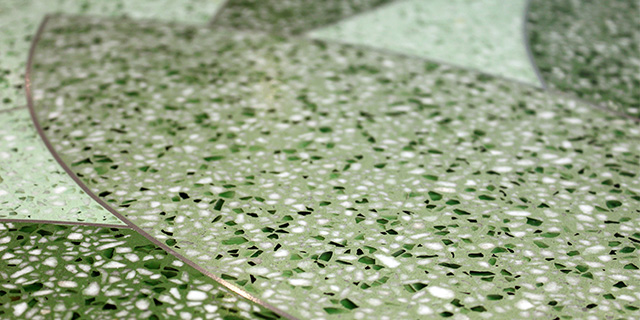 close up photo of green-themed seamless epoxy terrazzo floor