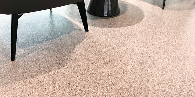 gold/clementine colour scheme of seamless epoxy flake coating in office lobby